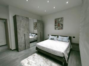 a bedroom with a bed and a mirror in it at Bella Vigevano in Vigevano +38 photos