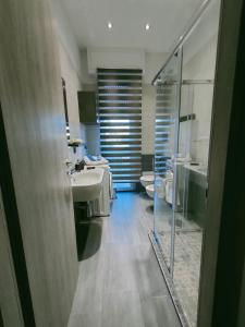 Vonios kambarys apgyvendinimo įstaigoje Bella Vigevano