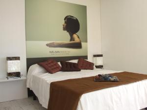 Postel nebo postele na pokoji v ubytování Hotel Muva Beach