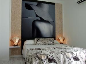 Postel nebo postele na pokoji v ubytování Hotel Muva Beach