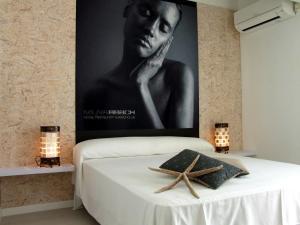 Postel nebo postele na pokoji v ubytování Hotel Muva Beach