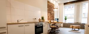 a kitchen with a sink and a stove top oven at Saargemünder 128 in Saarbrücken