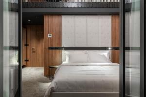 Postel nebo postele na pokoji v ubytování DeGrassi Boutique Garni Hotel Izola