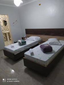 A bed or beds in a room at Hotel Ouro de Mauá