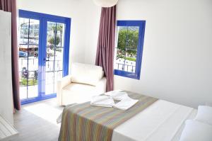 Cama o camas de una habitación en Gurup Hotel