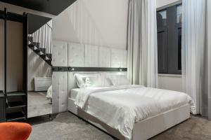 Postel nebo postele na pokoji v ubytování DeGrassi Boutique Garni Hotel Izola