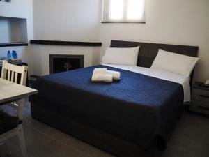 A bed or beds in a room at B&B I SIKULI