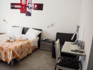 A bed or beds in a room at B&B I SIKULI