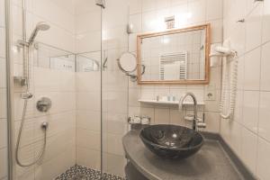 Kúpeľňa v ubytovaní Alpenhotel DAS KÜREN