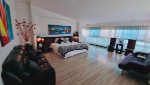 Voodi või voodid majutusasutuse Habitat Suites Hotel By GHO Hoteles toas