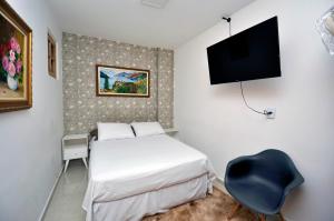 Ліжко або ліжка в номері Prático e confortável apto com 2 quartos totalmente equipado e perto de tudo