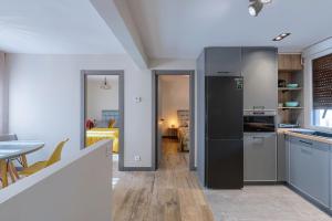 Kuchyň nebo kuchyňský kout v ubytování Vivienda Turística de Diseño Elegante + 16 fotografií