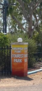 a sign that says kunmite joint tourist park at Karumba Point Holiday & Tourist Park in Karumba