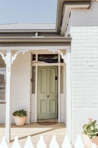 a front door of a house with a green door at Sweet Home Alexander in Burnie