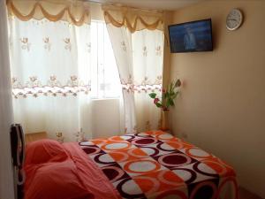 Cama o camas de una habitación en Hospedaje Kaihalulu