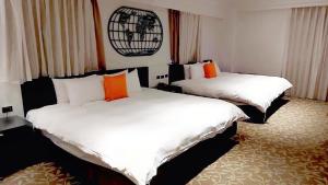 Voodi või voodid majutusasutuse Fulidun Hotel Kenting toas