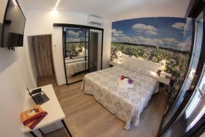 Postel nebo postele na pokoji v ubytování FP HOTELs