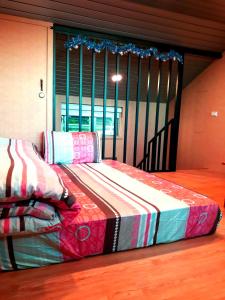 Katil atau katil-katil dalam bilik di Yun Cheng Homestay