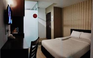 Postel nebo postele na pokoji v ubytování 7 Hotel