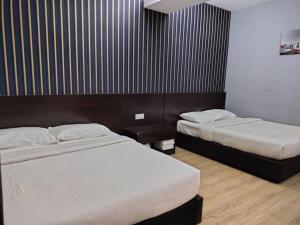 Postel nebo postele na pokoji v ubytování 7 Hotel