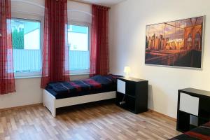 Postel nebo postele na pokoji v ubytování 3 Zimmerwohnung mit Garten