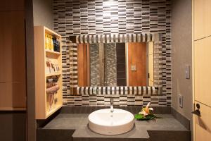 a bathroom with a white sink and a window at HOTEL MYTH-CLUB -ホテル マイス クラブ- Adult Only in Kyoto +97 photos