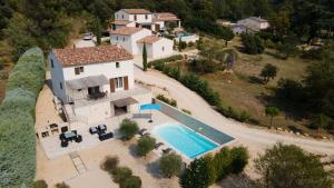 an aerial view of a house with a swimming pool at Le Petit Rossignol in Apt