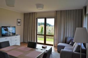 TV a/nebo společenská místnost v ubytování Komfort Apartament