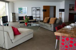 a living room with two couches and a table at Rayong Seaview Condo 230 sqm condo, 2 bedroom in Rayong