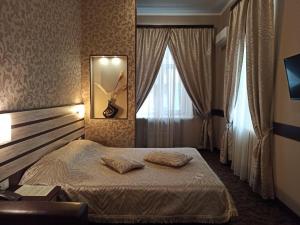 Posteľ alebo postele v izbe v ubytovaní Classic Hotel