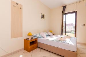 Posteľ alebo postele v izbe v ubytovaní Guesthouse Somnium