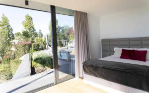 Posteľ alebo postele v izbe v ubytovaní Luxurious Golf Villa La Vinya 5 + 37 fotografií