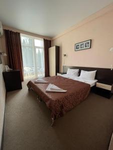 מיטה או מיטות בחדר ב-Hotel ANNA