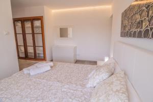 Łóżko lub łóżka w pokoju w obiekcie Finca CAN LLORENC by Mallorca Villa Selection