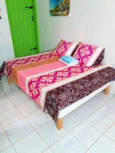 Кровать или кровати в номере Bungalow d'une chambre avec jardin et wifi a Petit Bourg