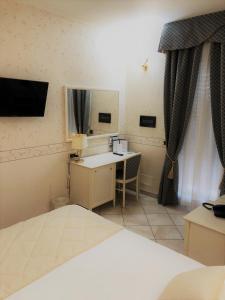 Postel nebo postele na pokoji v ubytování Hotel La Noce