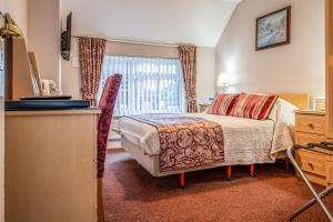 Letto o letti in una camera di The Olde Forge Hotel