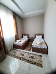 Ένα ή περισσότερα κρεβάτια σε δωμάτιο στο KU&NA HOTEL BELSH