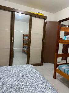 a bedroom with a bunk bed and a closet at Residencial Granito e Jasmim Flat em Jacumã vista para o Mar in João Pessoa +19 photos