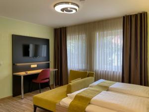 Ένα ή περισσότερα κρεβάτια σε δωμάτιο στο Hotel zur Flüh