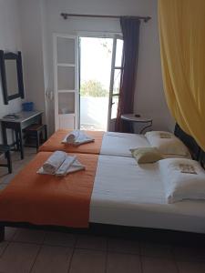 Postel nebo postele na pokoji v ubytování Pagali Hotel
