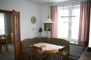 a living room with a couch and a table at Ferienhaus Frey in Eggebek