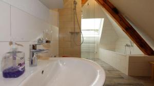 a bathroom with a sink and a bath tub at Hof Stallegg in Löffingen +166 photos