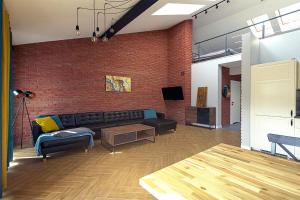 Televízia a/alebo spoločenská miestnosť v ubytovaní Sun&Sport Apartament PANORAMA dwupoziomowy i przestronny