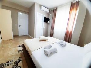 Ένα ή περισσότερα κρεβάτια σε δωμάτιο στο KU&NA HOTEL BELSH