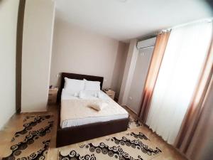 Ένα ή περισσότερα κρεβάτια σε δωμάτιο στο KU&NA HOTEL BELSH