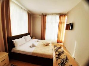 Ένα ή περισσότερα κρεβάτια σε δωμάτιο στο KU&NA HOTEL BELSH