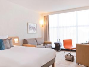 Cama ou camas em um quarto em Novotel Genève Centre