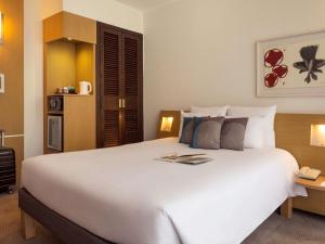 Cama ou camas em um quarto em Novotel Genève Centre