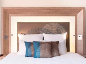 Cama ou camas em um quarto em Novotel Genève Centre